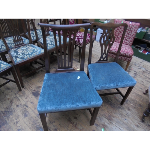 695 - Two oak dining chairs with re-upholstered seats.