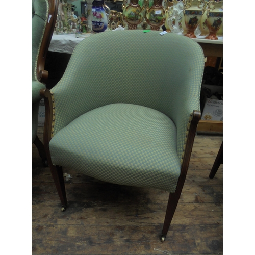 696 - Re-upholstered Edwardian tub chair with inlaid woods.