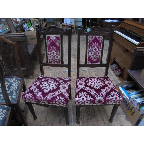 697 - Pair of Victorian dining chairs in Oak with upholstered seats and back.