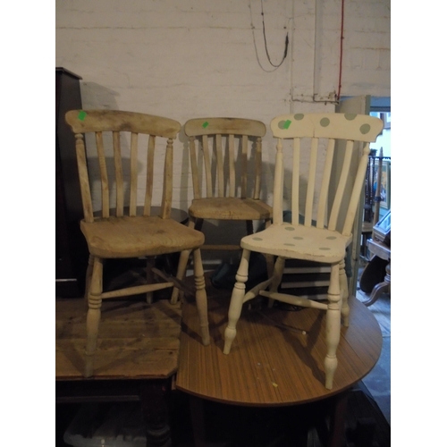 699 - Three stripped and dipped pine kitchen chairs.