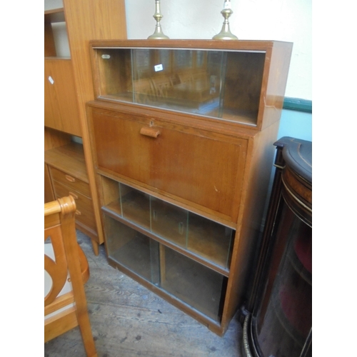 709 - 1960's/70's four tier display unit with three units having sliding glass doors and one central burea... 