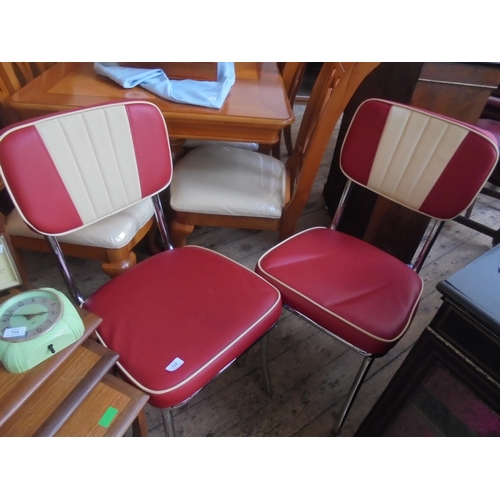 715 - Fine pair of American diner chairs on chrome in red and cream.