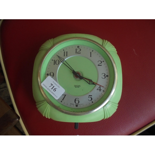 716 - 1950's electric clock in green.