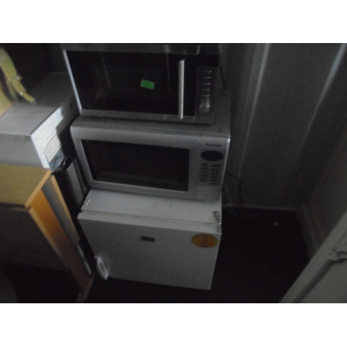 723 - x2 microwaves, table top fridge and tv.