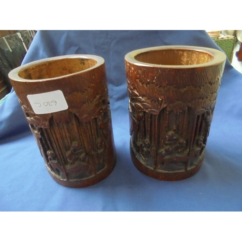 630C - Carved pair of Chinese brush pots, probably 19th century