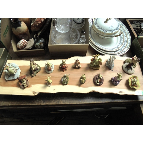 43 - Highly collectable set of 15 Enchantica figures on a wooden board