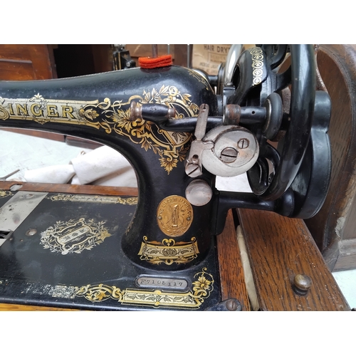 126 - Old cased Singer sewing machine