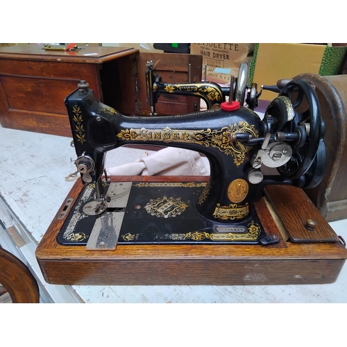 126 - Old cased Singer sewing machine