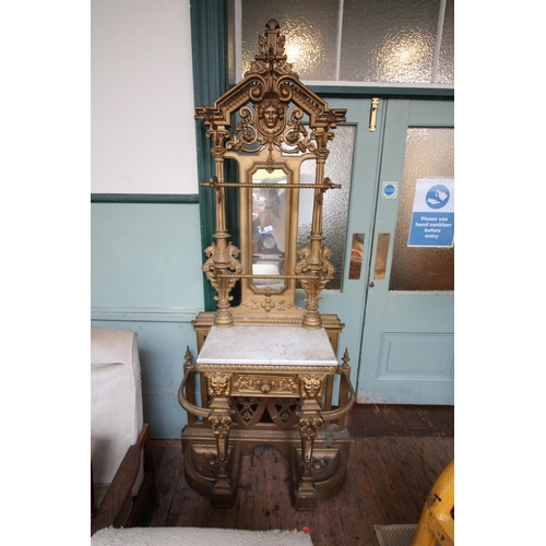 649 - Large heavy wrought iron ornate Victorian hall stand, marble base with drawer, mirror and hanging fa... 