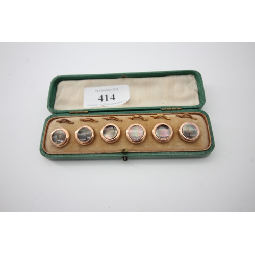 414 - Cased set of gold mounted buttons