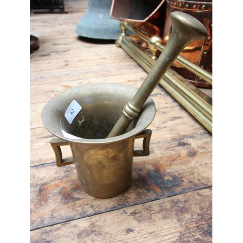 62 - Large brass mortar and pestle of vintage era