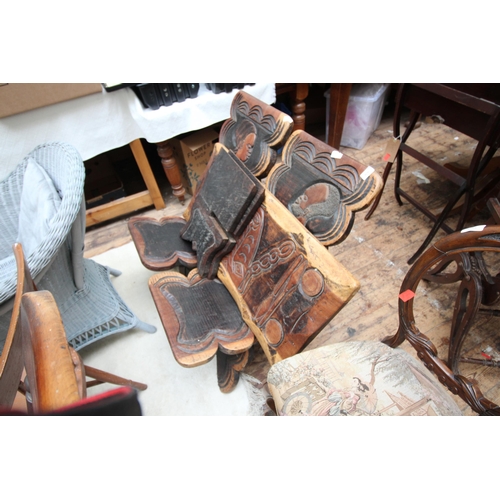 626 - Pair of African carved birthing chairs and table