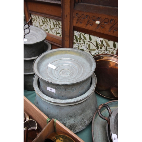 85 - 2 large lidded copper cooking vessels