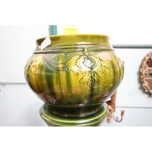 56 - Large green lustre jardiniere on stand, slight damage to rim