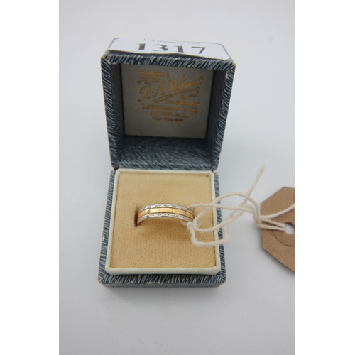 1317 - Gold wedding band marked 22ct, Birmingham 1964, 3.8 grams with platinum inset