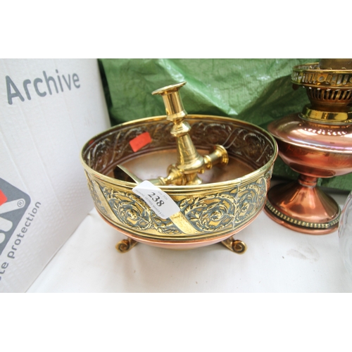 238 - Large brass and copper bowl on legs, together with early push-up candlesticks