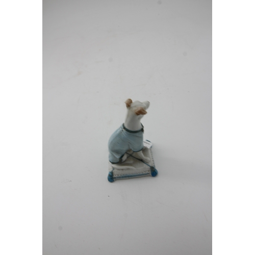 291 - Fine small proportioned ceramic greyhound on cushion, early figure