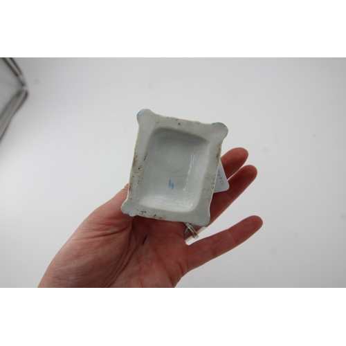 291 - Fine small proportioned ceramic greyhound on cushion, early figure