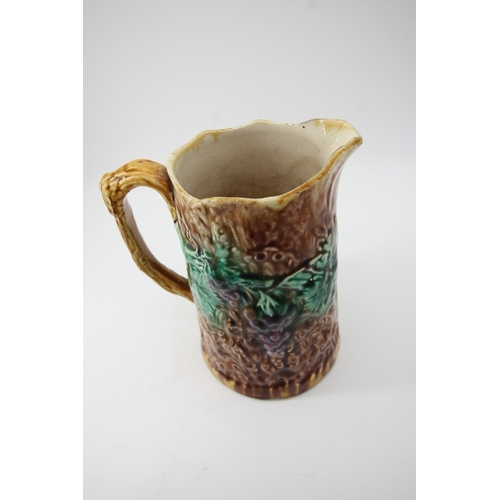 89 - Majolica Pottery jug moulded with fruit and vines (20cm tall)