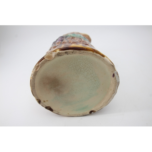 89 - Majolica Pottery jug moulded with fruit and vines (20cm tall)