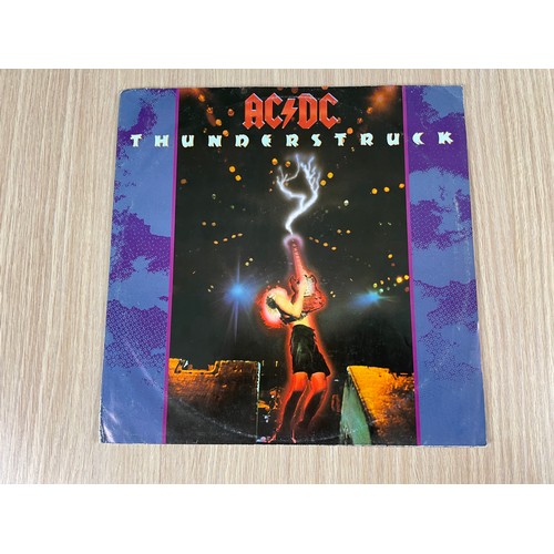 193 - AC/DC - Thunderstruck Rare 12 inch Vinyl Record with Poster cover. Cover and poster in VG+cond. Viny... 