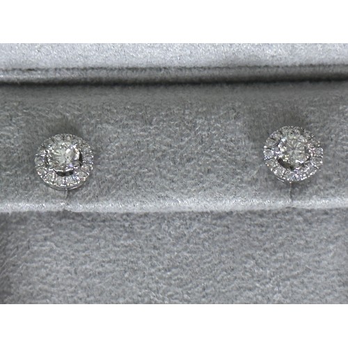 313 - Fine Jewellery - A Pair of unworn Diamond Halo / Cluster Stud Earrings. Un-hallmarked White Metal, s... 