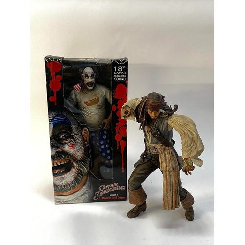 31 - A boxed figure of Captain Spaulding and a figure of Captain Jack Sparrow