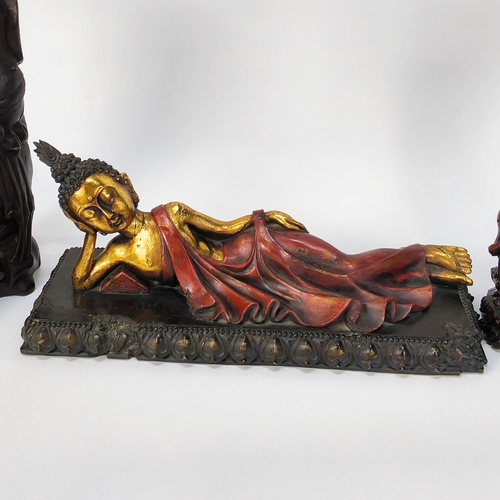 54 - A collection of six carved Oriental figures and a figure of a Buddha