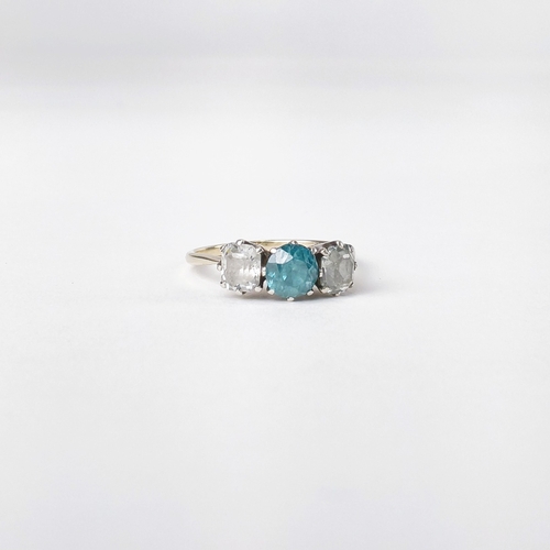 An 18k diamond two stone ring, set with central blue topaz