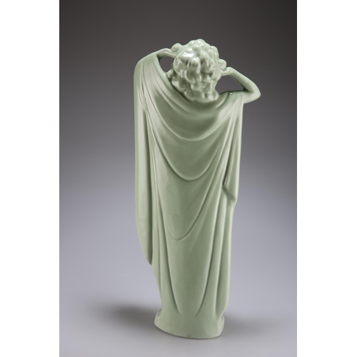 129 - A LARGE CONTINENTAL PORCELAIN FIGURE OF A FEMALE NUDE, IN THE ART DECO TASTE, green glazed, modelled... 