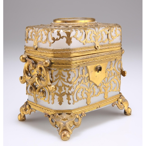 36 - A CONTINENTAL GILT-METAL MOUNTED OPALINE GLASS SCENT BOTTLE CASKET, 19TH CENTURY, canted rectangular... 