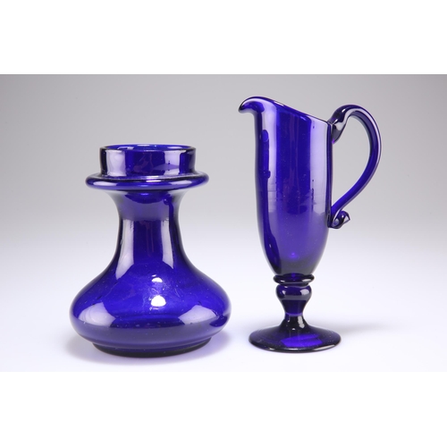 43 - AN EARLY 19TH CENTURY BRISTOL BLUE GLASS JUG AND BULB VASE, the tall cream ewer with loop handle and... 