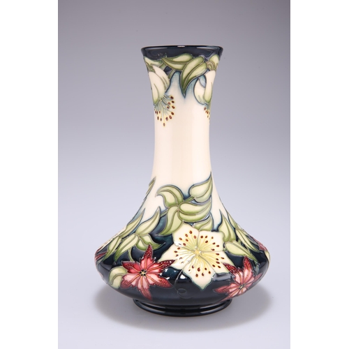 57 - A MOORCROFT POTTERY VASE, by Nicola Slaney, tubelined and hand-painted with the Christmas Rose patte... 