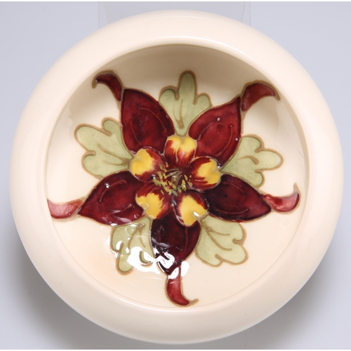 59 - A MOORCROFT POTTERY SMALL BOWL, circular, tubelined and hand-painted with Columbine, impressed 'MOOR... 