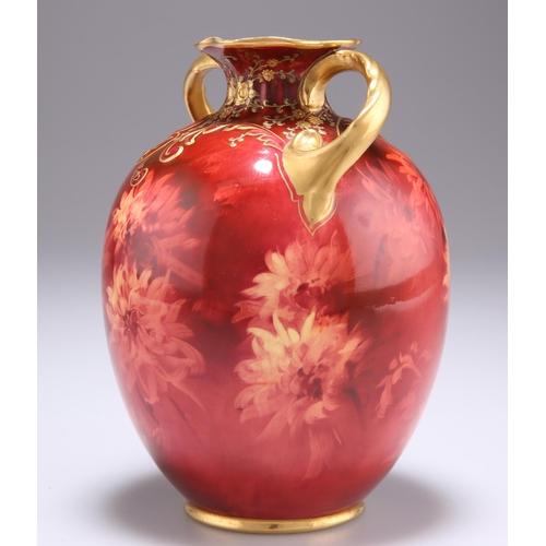 69 - A DOULTON BURSLEM VASE, by Fred Hancock, decorated with flowerheads in monochrome ruby, highlighted ... 