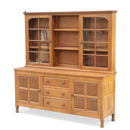 727 - BOB HUNTER, A WRENMAN OAK DRESSER, the upper section with a pair of glazed doors flanking open shelv... 