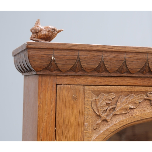 727 - BOB HUNTER, A WRENMAN OAK DRESSER, the upper section with a pair of glazed doors flanking open shelv... 