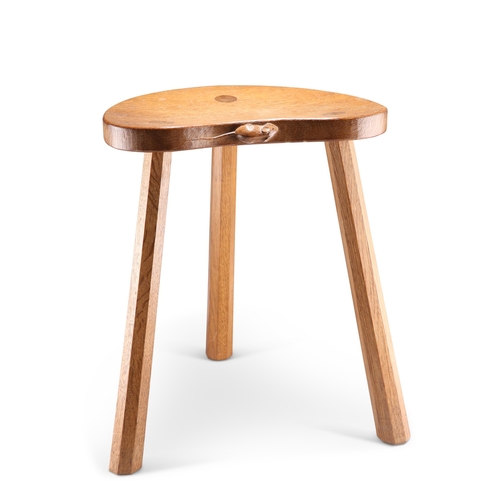 731 - ROBERT THOMPSON, A MOUSEMAN OAK MILKING STOOL, the kidney shaped adzed seat raised on three faceted ... 