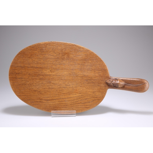 736 - ROBERT THOMPSON, A MOUSEMAN OAK CHEESEBOARD, adzed oval form with carved mouse signature to the hand... 