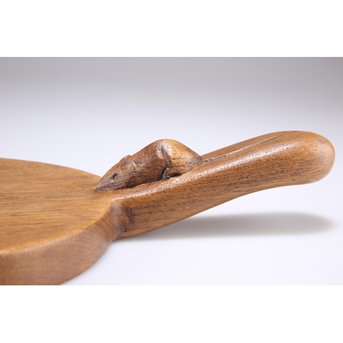 736 - ROBERT THOMPSON, A MOUSEMAN OAK CHEESEBOARD, adzed oval form with carved mouse signature to the hand... 