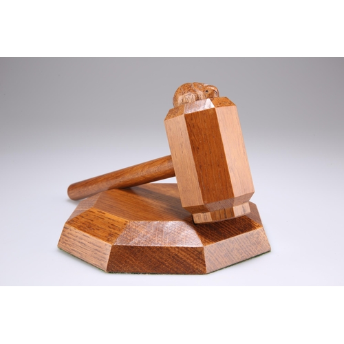 738 - PETER HEAP, A RABBITMAN OAK GAVEL AND BLOCK, CIRCA 1970S, the gavel with octagonal head and carved r... 