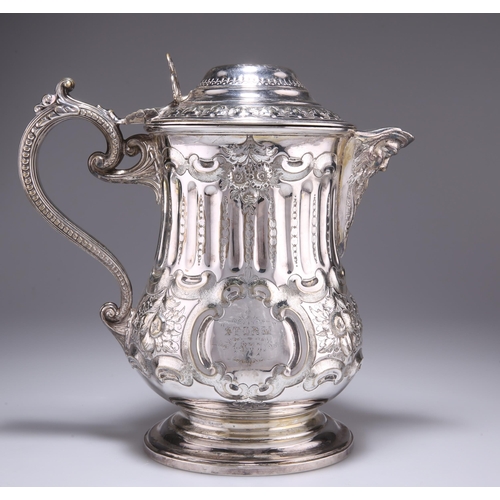1027 - A LARGE 19TH CENTURY SILVER-PLATED FLAGON, with mask-form spout and beaded S-scroll handle, engraved... 