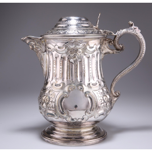 1027 - A LARGE 19TH CENTURY SILVER-PLATED FLAGON, with mask-form spout and beaded S-scroll handle, engraved... 