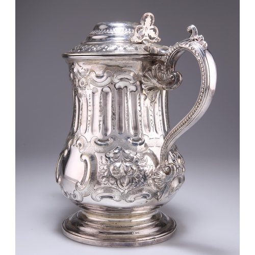 1027 - A LARGE 19TH CENTURY SILVER-PLATED FLAGON, with mask-form spout and beaded S-scroll handle, engraved... 