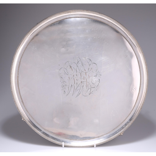 1036 - AN OLD SHEFFIELD PLATE SALVER, CIRCA 1790, circular with beaded borders and shell-cast scroll feet, ... 