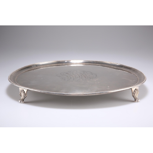 1036 - AN OLD SHEFFIELD PLATE SALVER, CIRCA 1790, circular with beaded borders and shell-cast scroll feet, ... 
