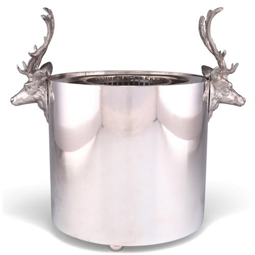 1016 - A SILVER-PLATED WINE COOLER, cylindrical, with stag's head handles, complete with liner. 25cm high