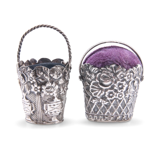 1031 - TWO EARLY 19TH CENTURY SILVER NOVELTY PIN CUSHIONS, each in the form of a basket with swing-handle, ... 