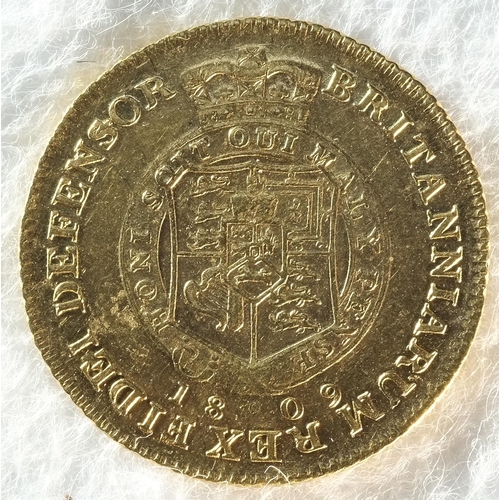 192 - George III (1760 - 1820) 1809 half-guinea. Obv: Second laureate head right. Rev: Shield in garter, d... 