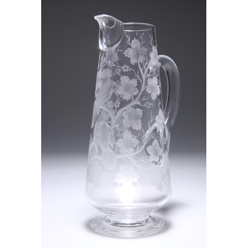 10 - A 19TH CENTURY GLASS JUG, PROBABLY STOURBRIDGE, cut with two birds amidst leafy branches. 25.5cm hig... 